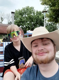 a man in a cowboy hat and a boy in a cowboy hat